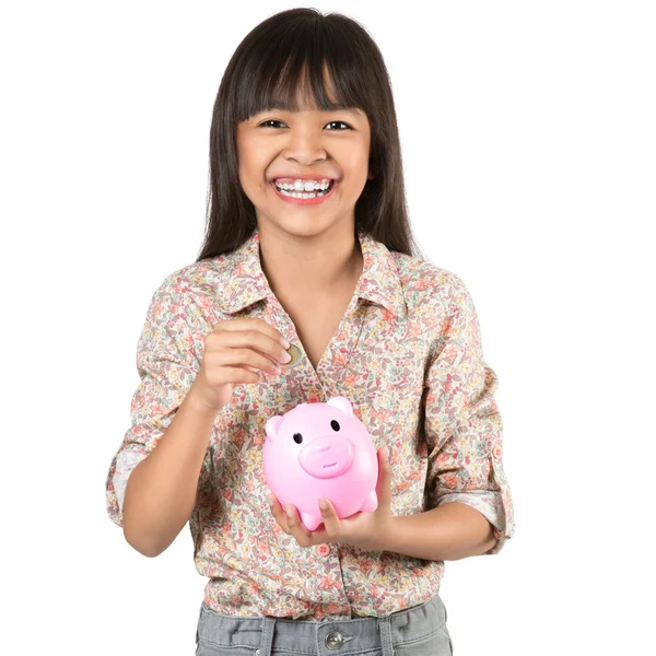 Kleine asiatische Mädchen mit Sparschwein — Stockfoto