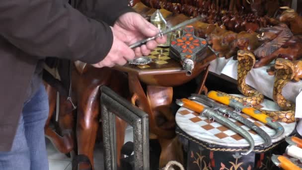 Man choosing Moroccan knife — Stock Video