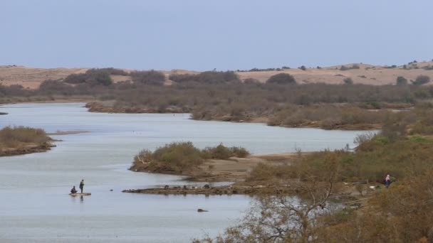 People crossing river on raft in Africa — Stock Video