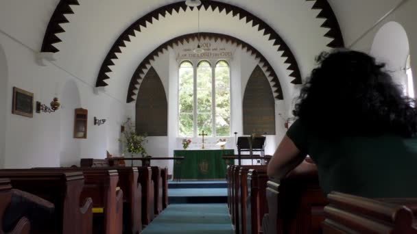 Woman in a small white church — Stock Video