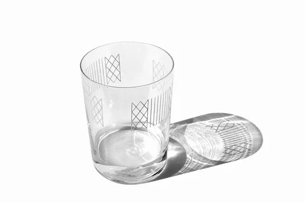 Decorated clear glass with some water isolated — Stock Photo, Image