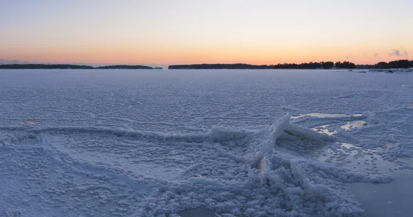 Winter sunset at frozen sea — Stock Photo, Image