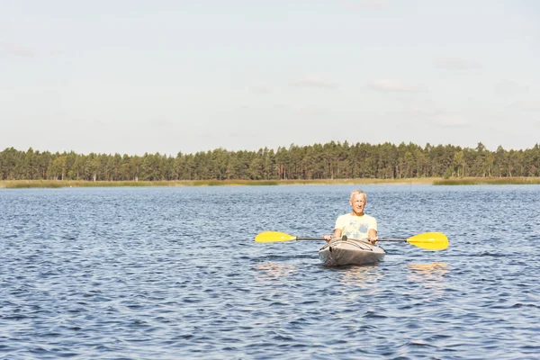 Man is driving kayak in water — Stock Photo, Image