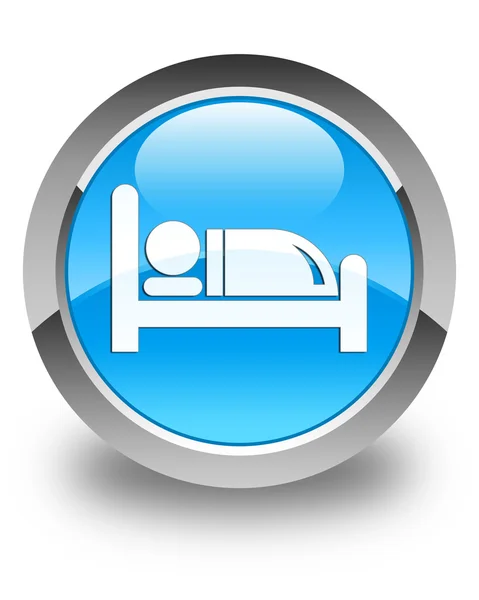 Блестящая голубая пуговица с изображением кровати отеля — стоковое фото