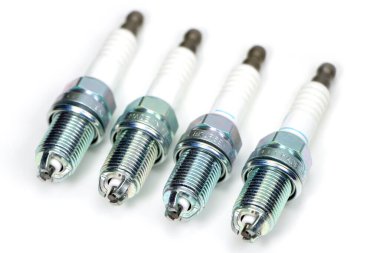 Spark plug for the car, isolated on a white background. clipart