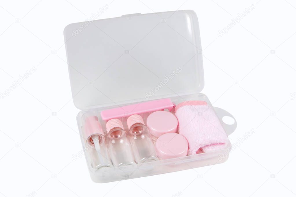 Travel small bottle set, in transparent cosmetic bag on a white background.