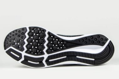 Sole of sport shoe on white background.