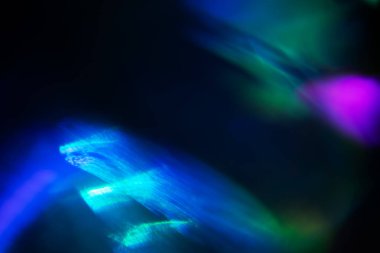 Soyut bulanık lensler siyah renkte parlıyor.