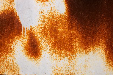 Paslı metal arka planda pas izleri var. Pas lekeleri. Metal yüzey paslanmış lekeler. Paslanmış aşınma