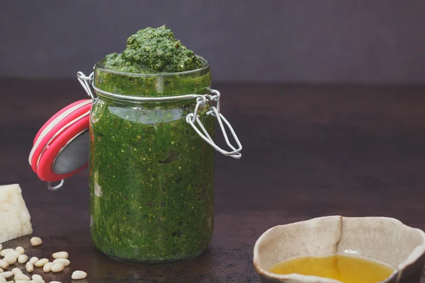 Homemade pesto in a flip top jar — Stock Photo, Image