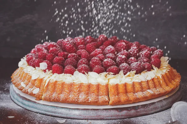 Raspberry and lemon cream tart with flaked almonds — Stock Photo, Image