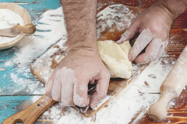 Hand kneading pizza dough — Stock Photo, Image