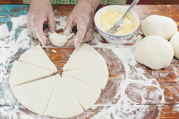 Baker making mini croissants — Stock Photo, Image