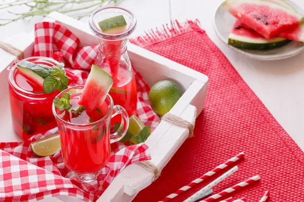 Watermelon cocktails on a rustic wooden tray — Stock Photo, Image