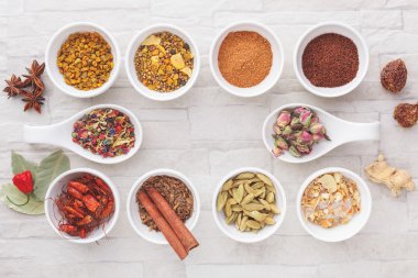 Various spices in small bowls clipart