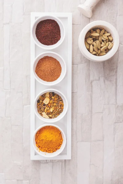 Indian spices with mortars and pestle — Stock Photo, Image