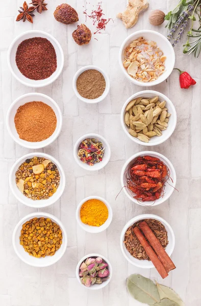 Various spices, dried and fresh herbs on table — Stock Photo, Image