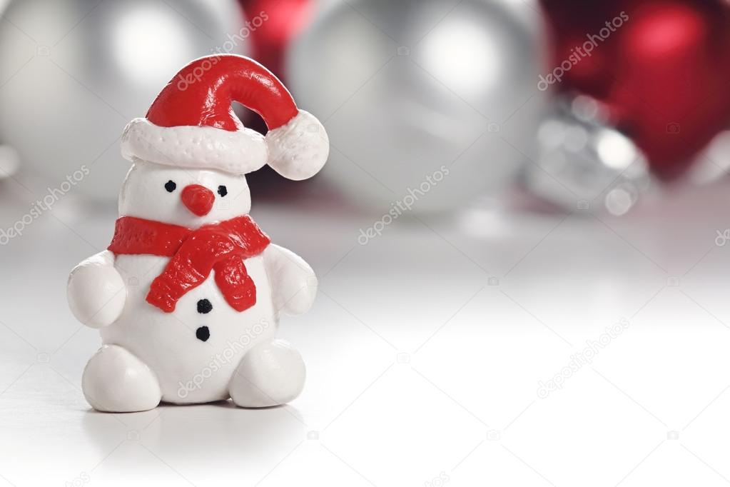 Snowman with Santa hat. Christmas greeting card with copy space