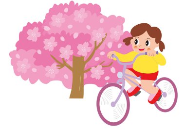 Yanında çiçek açmış kiraz çiçekleriyle bisiklet süren bir kız.