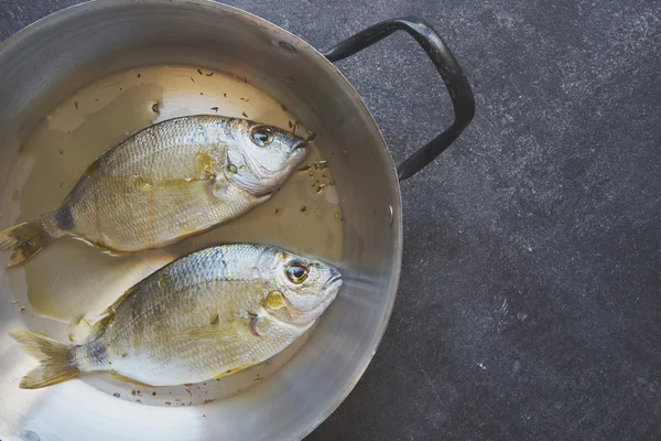 Fish on an old pan — Stock Photo, Image