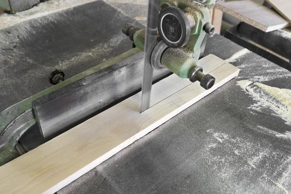 stock image Band saw cutting piece of wood