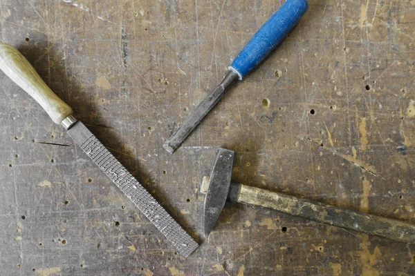 stock image Old carpenters hammer rasp and chisel on vintage wooden backgrou