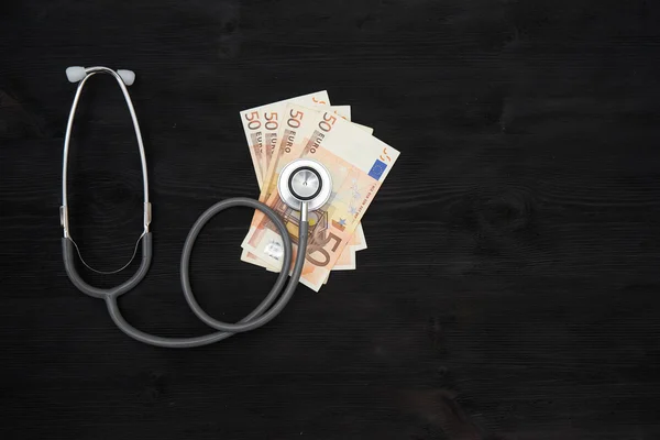 Stethoscope on top of euro banknotes, — Stock Photo, Image