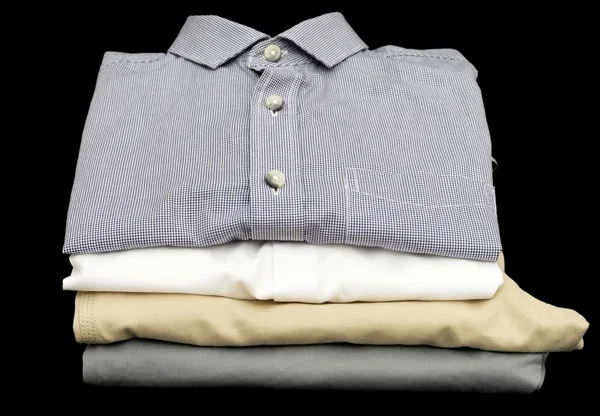 Close up of folded shirts and pants Stock Image