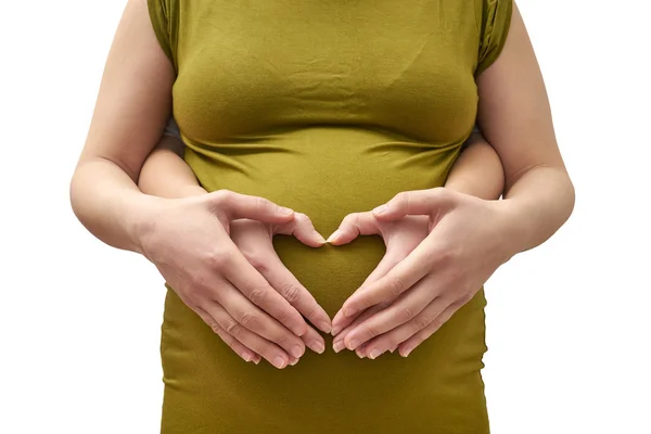 Un par de mujeres haciendo una forma de corazón en el ingenio vientre embarazada —  Fotos de Stock
