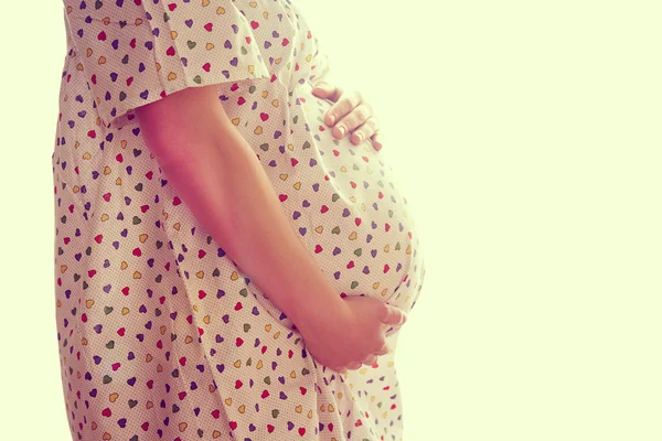 Image of pregnant woman touching her belly with hands — Stock Photo, Image