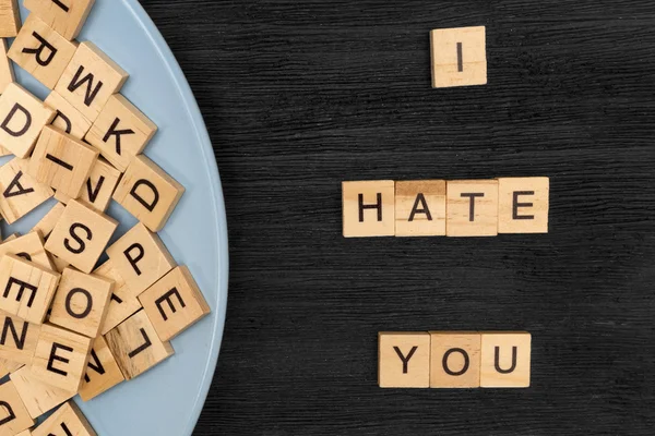 Wooden letters spelling I hate you — Stock Photo, Image