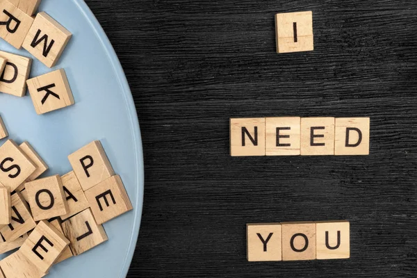 Wooden letters spelling I need you — Stock Photo, Image