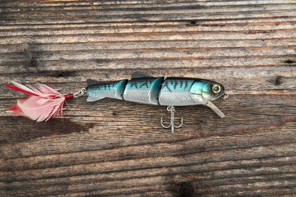 Рыбалка приманка изолированы на деревянном фоне — стоковое фото