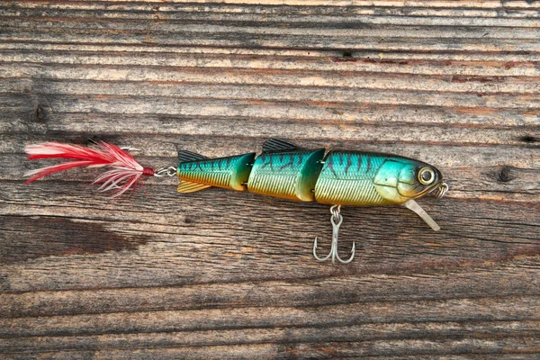Fishing bait isolated on wooden background