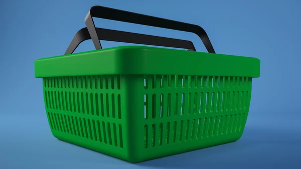 Cesta de compras verde fundo azul — Fotografia de Stock