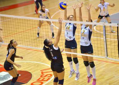 BUCHAREST, ROMANIA - OCTOBER 10:Raluca Bucur, CSU Cluj, attacks during the match between CSM Bucharest and CSU Cluj, Romanian Volleyball National Championship October 10, 2014 Bucharest, Romania