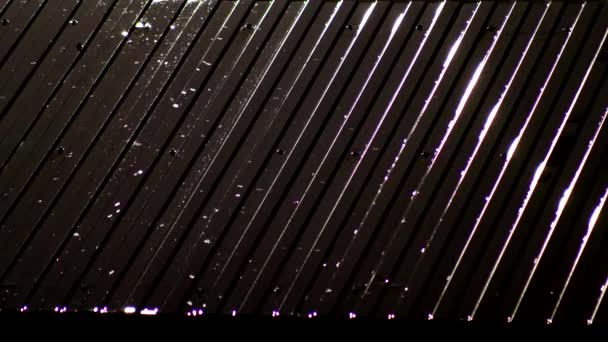 Raindrops dripping on the roof of the house at night, in the background. Heavy rain, copy space for text — Stock Video