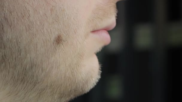 Unshaven man with red stubble scratches his double chin beard, close-up — Stok Video