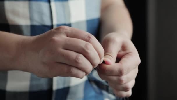 A man opens a package with a slimming, fat burning plaster. Close-up, metabolism — Stock Video