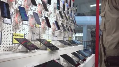 Choosing and buying a modern phone and gadget. Electronics store, shopping, close-up