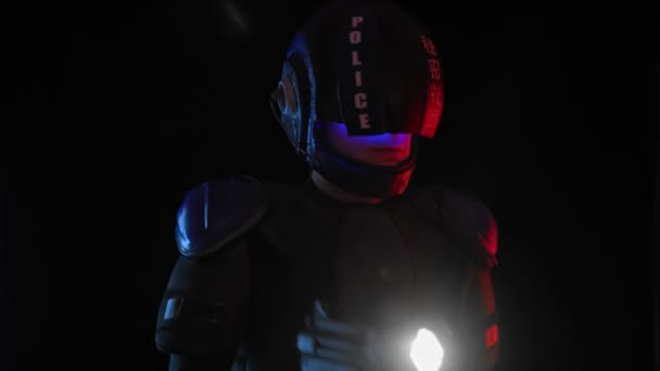 Cyberpunk concept, future world. Police officer cop, halfman bionic cyborg or android holds weapon gun with lantern is in dark. Science fiction scene, fantasy, sci. Portrait. Red blue light. Law Order — Stock video