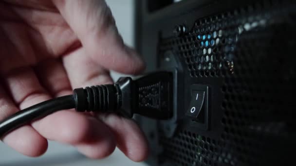 Defective power cord in the computer that powers the power supply. Mans hand straightens an electrical wire, close-up — Stock Video