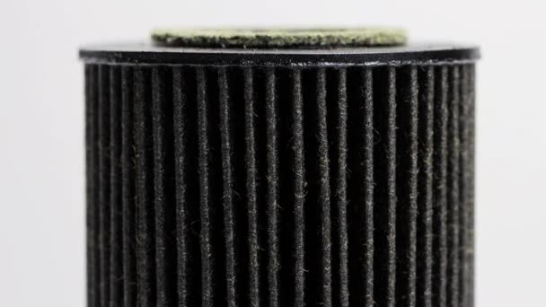 Car oil filter insert on white background. The concept of cleaning oil from dirt and impurities, macro — Stock Video