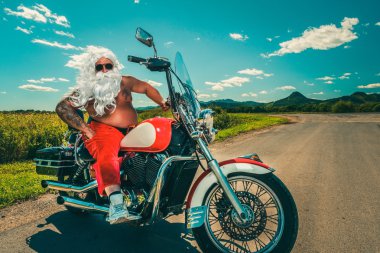 Santa on a motorcycle clipart