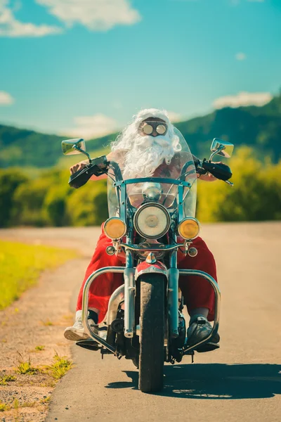 Santa em uma motocicleta — Fotografia de Stock