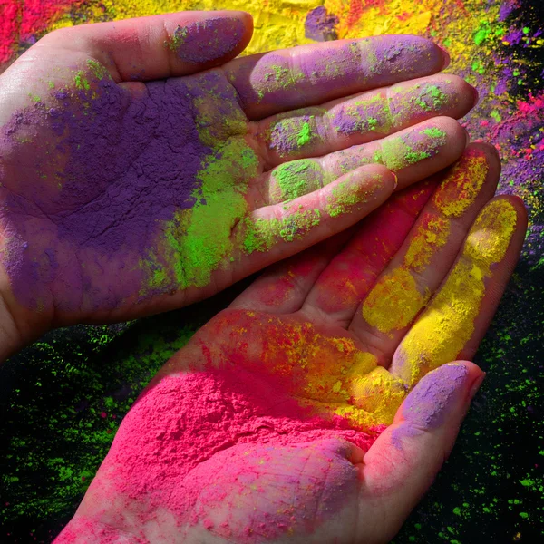 Manos con pintura holi — Foto de Stock