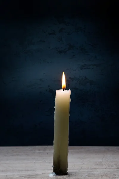 Burning candle on table — Stock Photo, Image