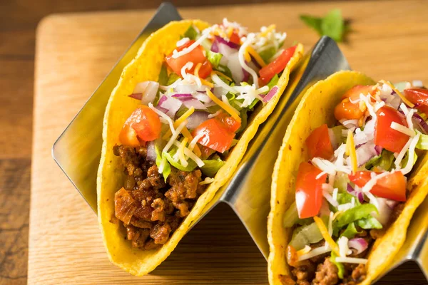 Homemade Ground Beef Hard Shell Tacos with Lettuce and Tomato