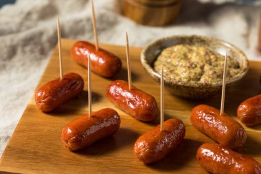 Homemade Warm Cocktail Weenies with Ground Mustard clipart