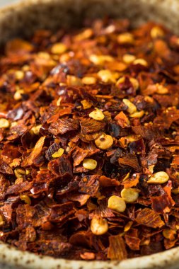 Organic Raw Red Pepper Flakes in a Bowl